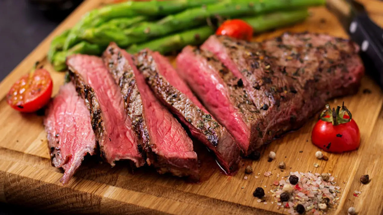 1613785691-040847900_1594351521-juicy-steak-rare-beef-with-spices-wooden-board-garnish-asparagus_2829-1513.webp